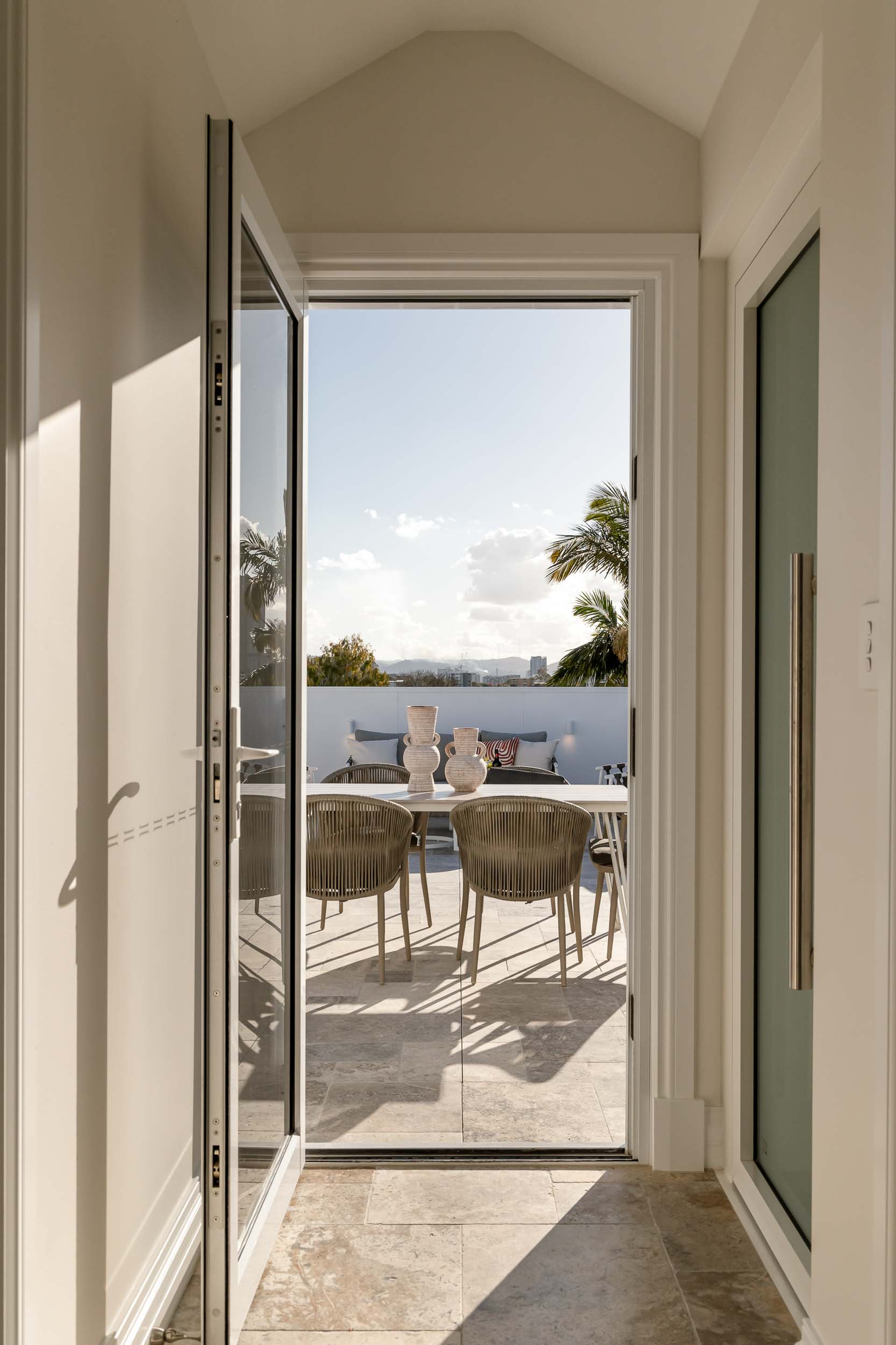 Brisbane home with freshly painted interior opening to outdoor patio with natural light and modern finishes