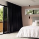 Modern bedroom in Brisbane with painted feature wall, soft neutral tones and natural light