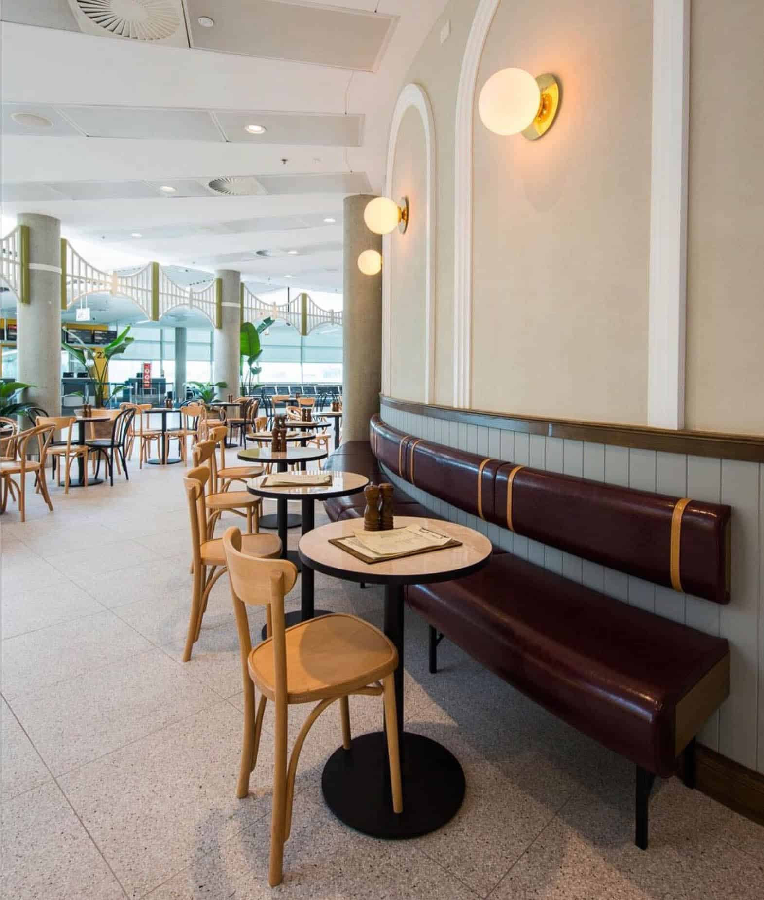 Modern cafe interior in Brisbane with painted walls, curved seating and hospitality fitout